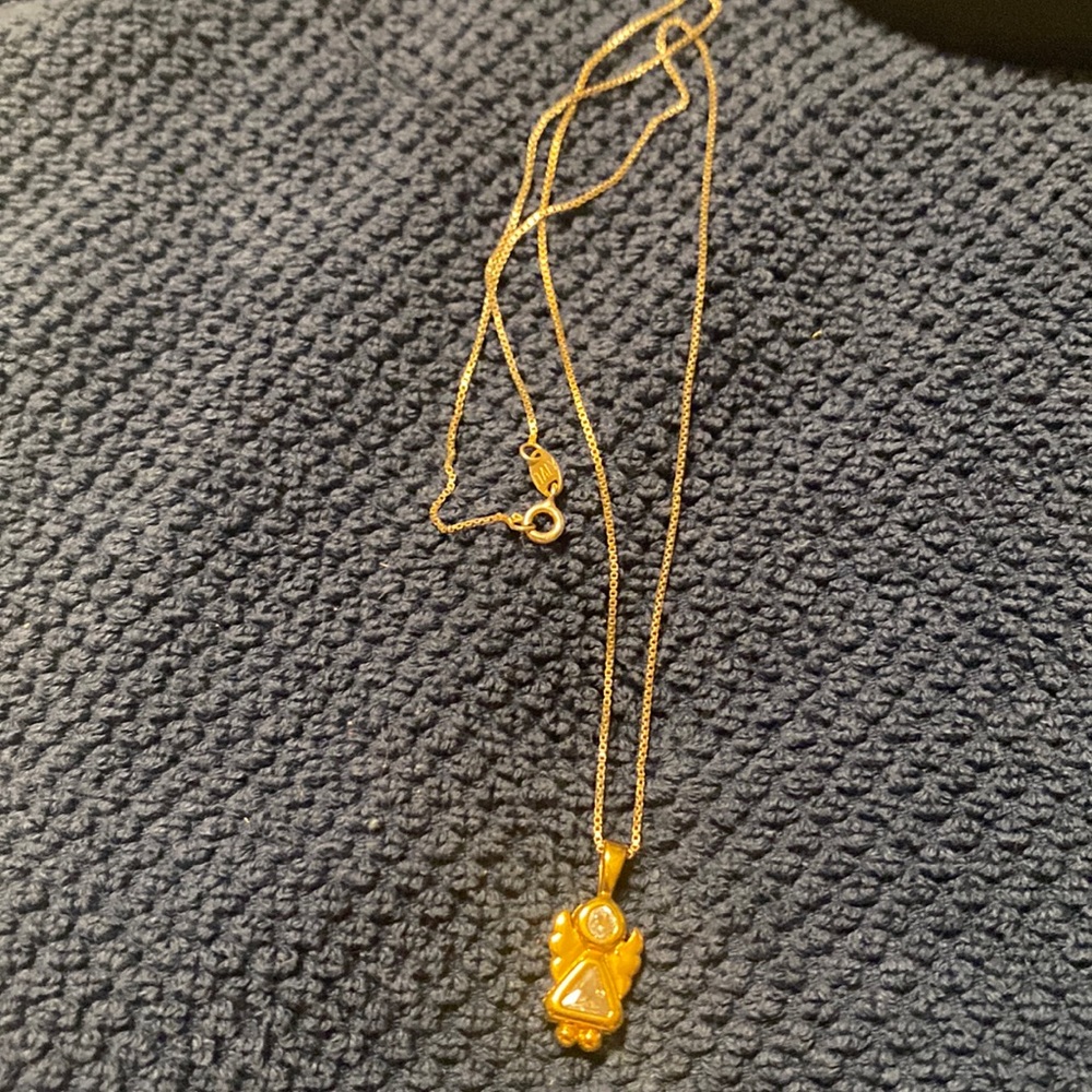 Gold over silver chain and angel charm.